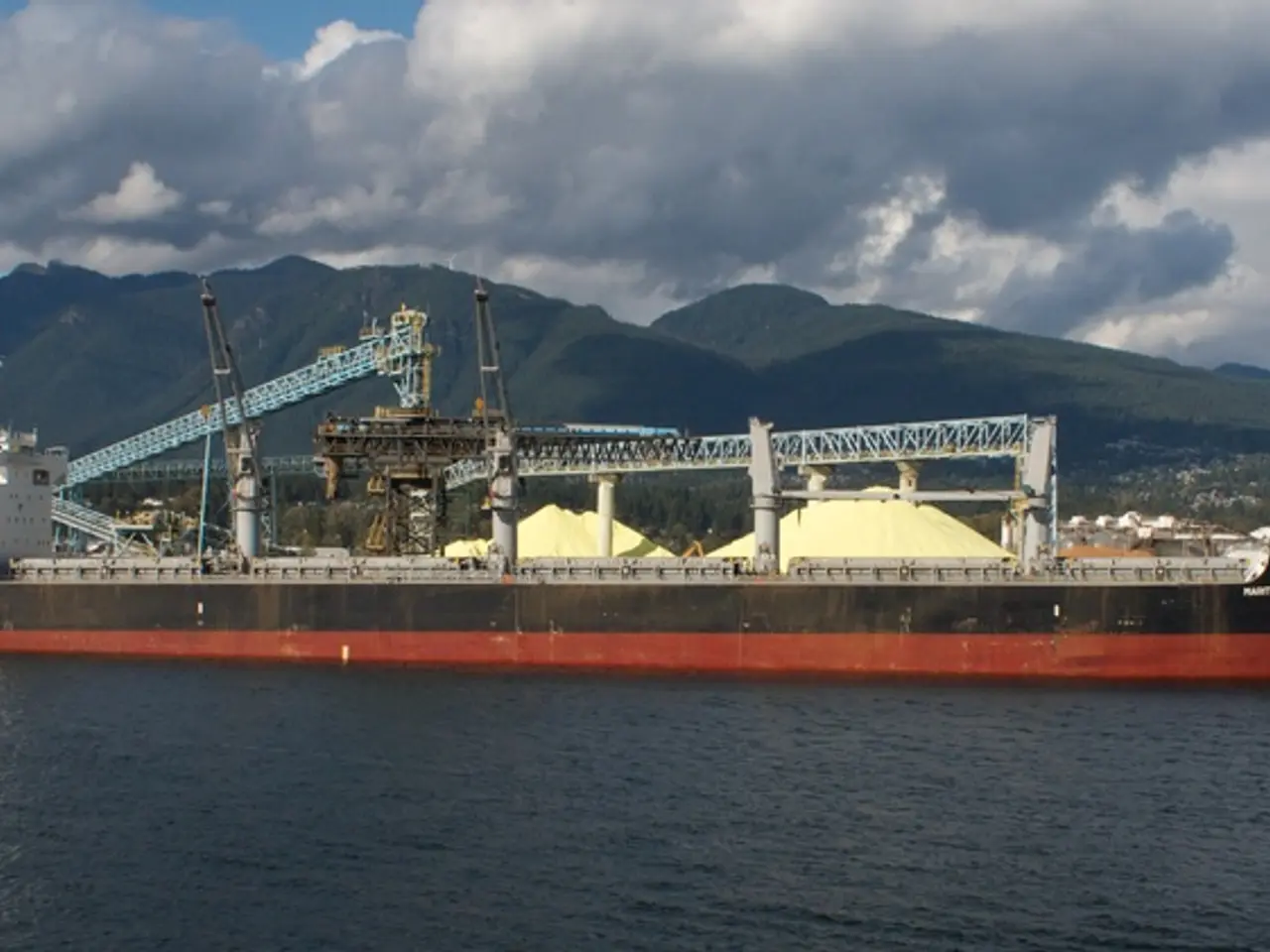 In this picture I can see there is a ship sailing on the water. There are iron frames in the...