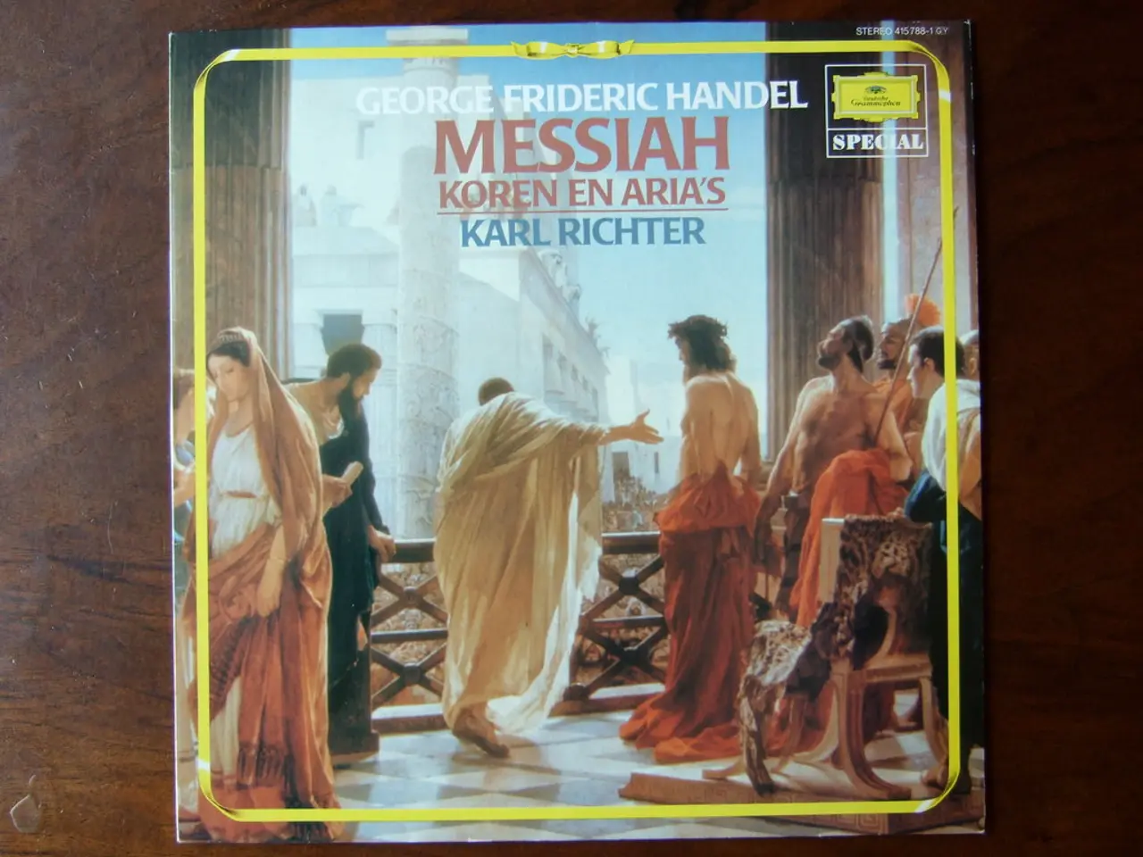 Here we can see a card on a platform. On the card we can see the pictures of few persons standing...