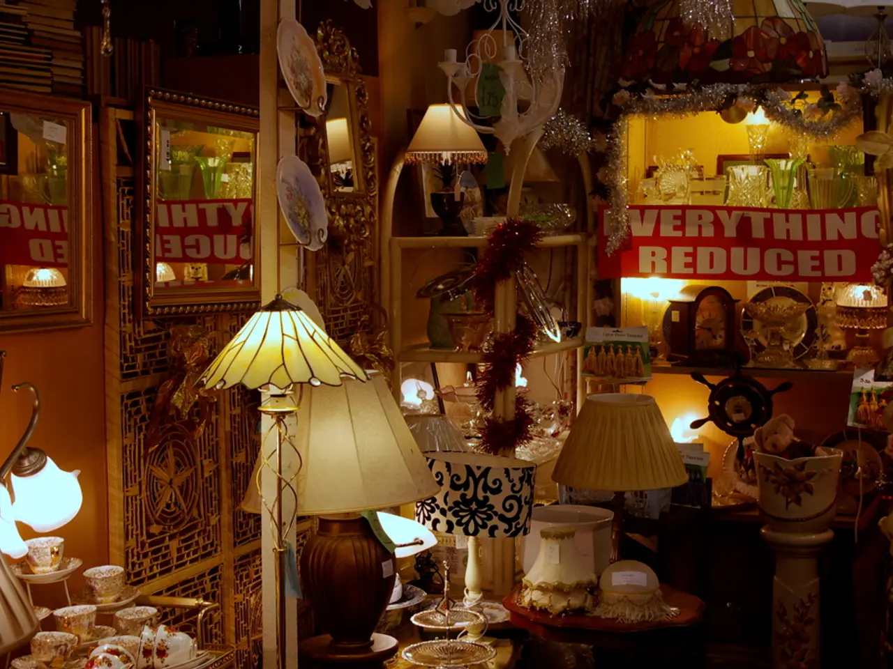 In this image, we can see some lamps, glasses and plates. There are photo frames on the left side...