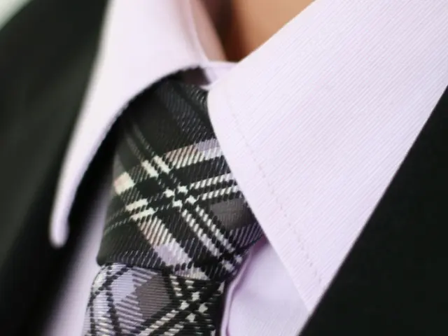 Airport attire solution elevated: Soft black tailoring and crisp white trainers, as suggested by...