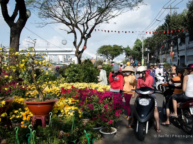 In this picture we can see a group of people wore helmets, caps and some are walking and some are...